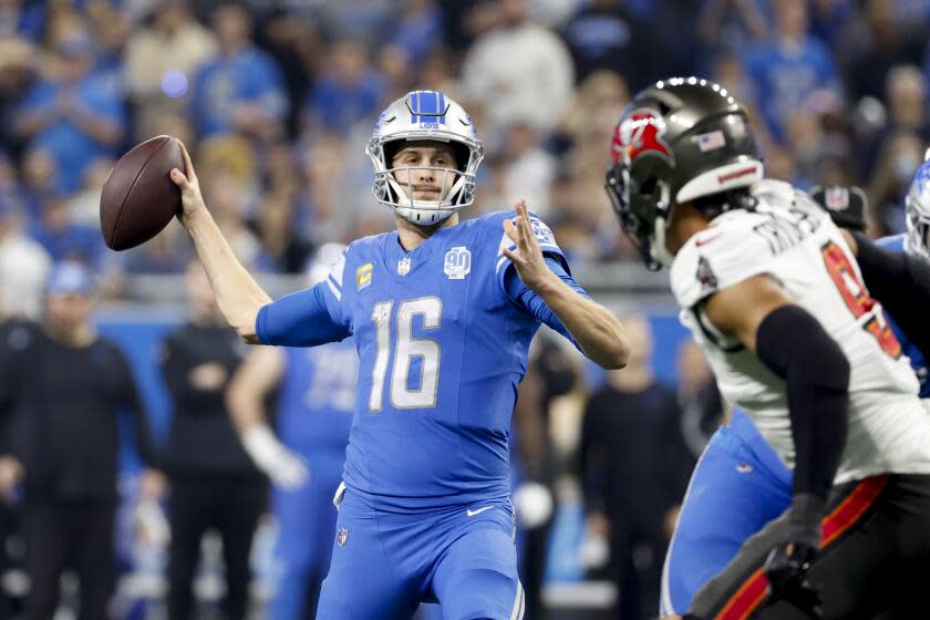 Detroit Lions quarterback Jared Goff (16) passes for a touchdown in the first half.