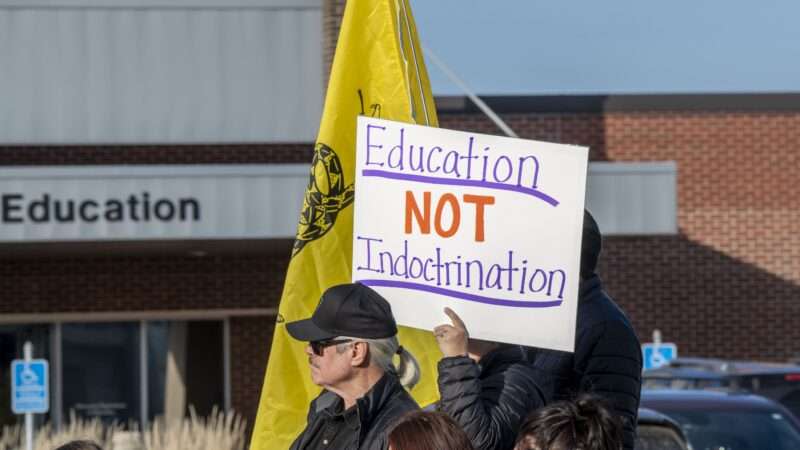 Protesters in St. Paul, Minnesota, hold a sign saying "Education NOT indoctrination."