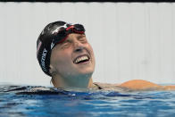 Kathleen Ledecky, of United States, celebrates after winning the gold medal in the women's 800-meter freestyle final at the 2020 Summer Olympics, Saturday, July 31, 2021, in Tokyo, Japan. (AP Photo/Gregory Bull)