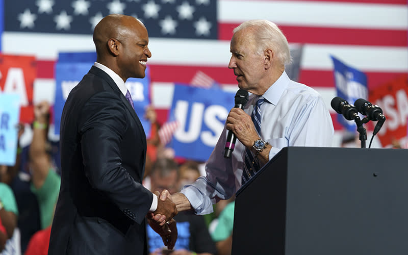 Democratic nominee for Maryland governor Wes Moore shakes hands with President Biden