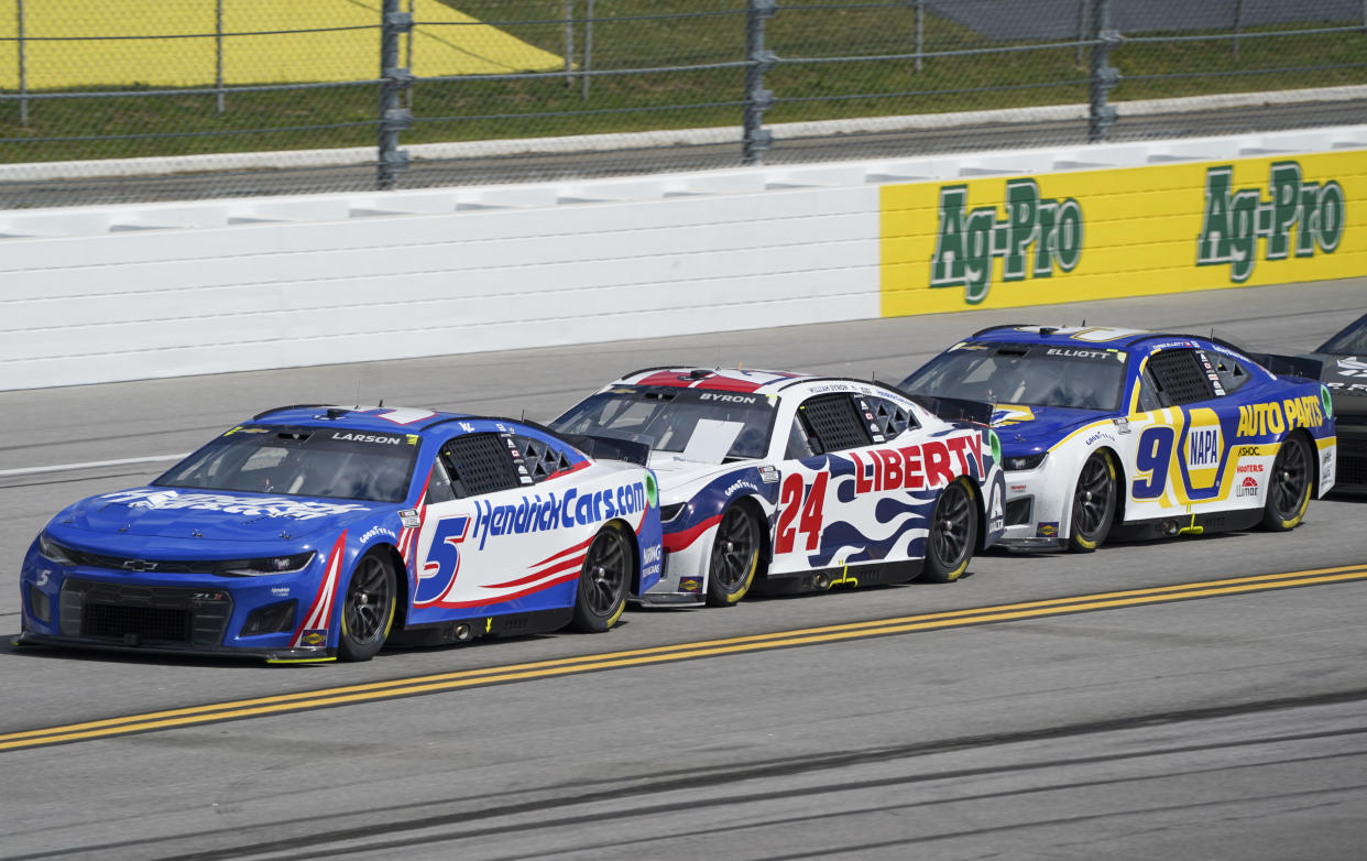 Apr 24, 2022; Talladega, Alabama, USA; NASCAR Cup Series driver Kyle Larson (5) NASCAR Cup Series driver William Byron (24) and NASCAR Cup Series driver Chase Elliott (9) during the GEICO 500 at Talladega Superspeedway. Mandatory Credit: Marvin Gentry-USA TODAY Sports