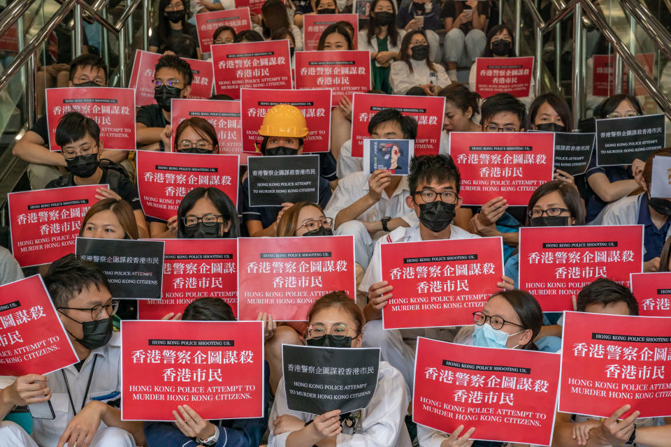 Members of the medical profession gather to protest against Hong Kong police brutality at Queen Elizabeth Hospital on August 13, 2019 in Hong Kong, China. (Photo: Philip Fong/NurPhoto via Getty Images)