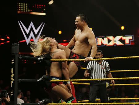 WWE wrestler Bin Wang of China hits opponent Wesley Blake during a taping of the WWE's NXT show at Full Sail University in Winter Park, Florida, November 30, 2016. REUTERS/Scott Audette