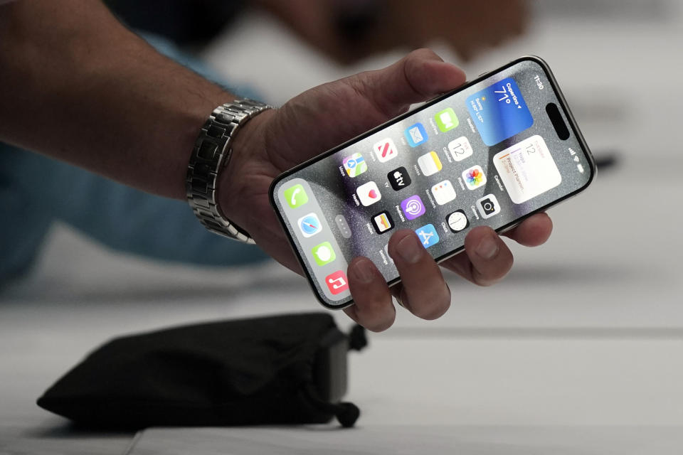 File - The iPhone 15 Pro is shown after its introduction on the Apple campus, Sept. 12, 2023, in Cupertino, Calif. Apple rolled out an update to its iOS operating system this week with a feature called Stolen Device Protection that makes it a lot harder for phone thieves to access key functions and settings. Users are being urged to turn it on immediately. (AP Photo/Jeff Chiu)