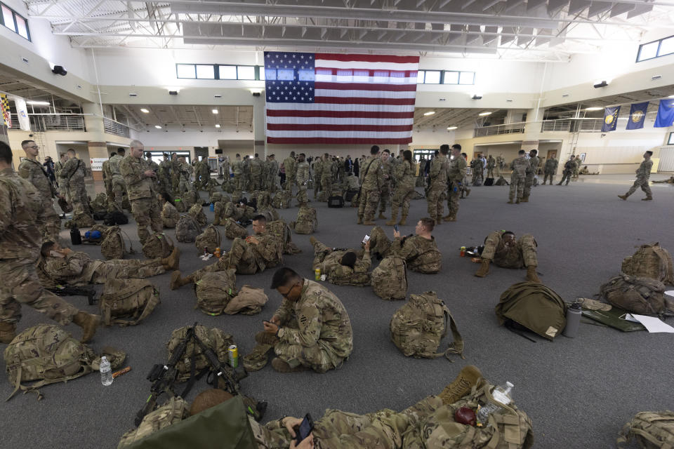 Over 180 soldiers with the U.S. Army 3rd Infantry Division, 1st Armored Brigade Combat Team wait before being deployed to Germany from Hunter Army Airfield, Wednesday March 2, 2022 in Savannah, Ga. The division is sending 3,800 troops as reinforcements for various NATO allies in Eastern Europe. (Stephen B. Morton /Atlanta Journal-Constitution via AP)