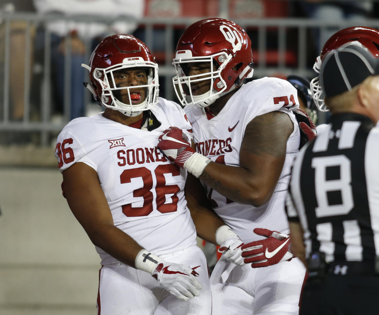 Oklahoma running back Dimitri Flowers, left, celebrates his touchdown against Ohio State with teammate Bobby Evans during the second half of an NCAA college football game, Saturday, Sept. 9, 2017, in Columbus, Ohio. (AP Photo/Paul Vernon)