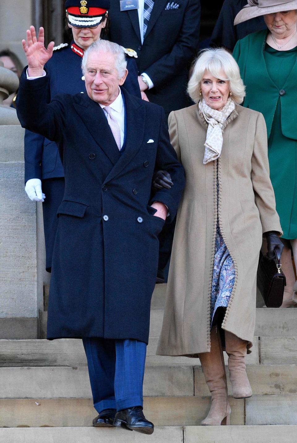 Britain's King Charles III and Britain's Camilla, Queen Consort leave after visiting Bolton Town Hall in Bolton, north west England on January 20, 2023, where they met with representatives from the community. (Photo by Oli SCARFF / AFP) (Photo by OLI SCARFF/AFP via Getty Images) ORIG FILE ID: AFP_337G9JK.jpg