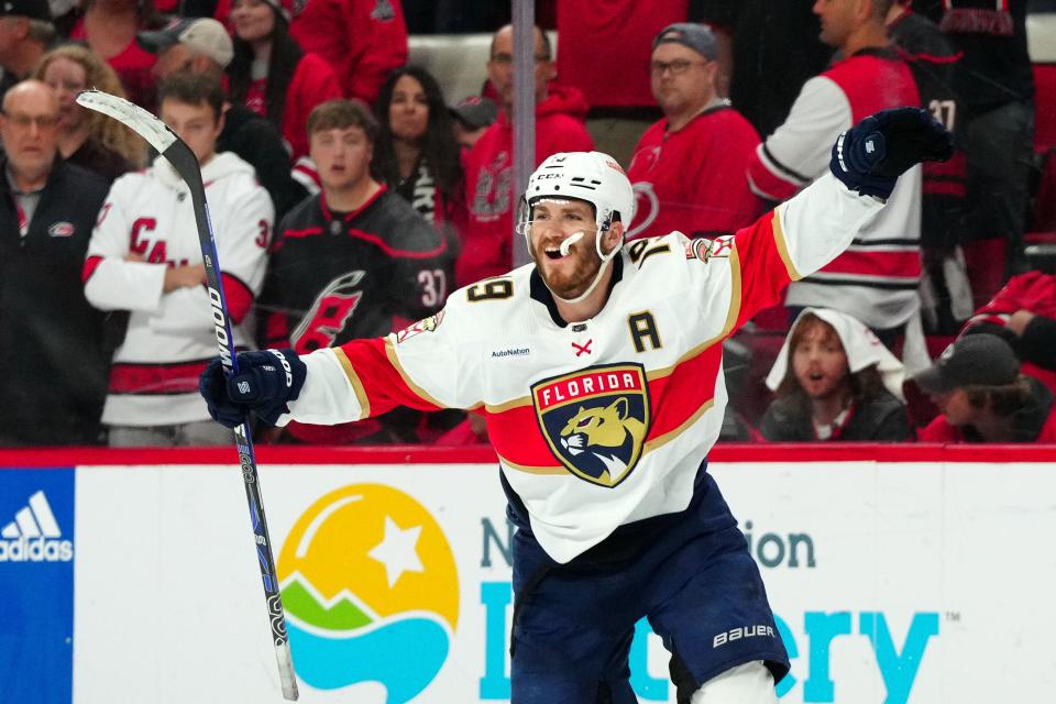 The Panthers' Matthew Tkachuk celebrates his winning goal in the fourth overtime, lifting Florida over Carolina 3-2 in the sixth-longest game in NHL history.
