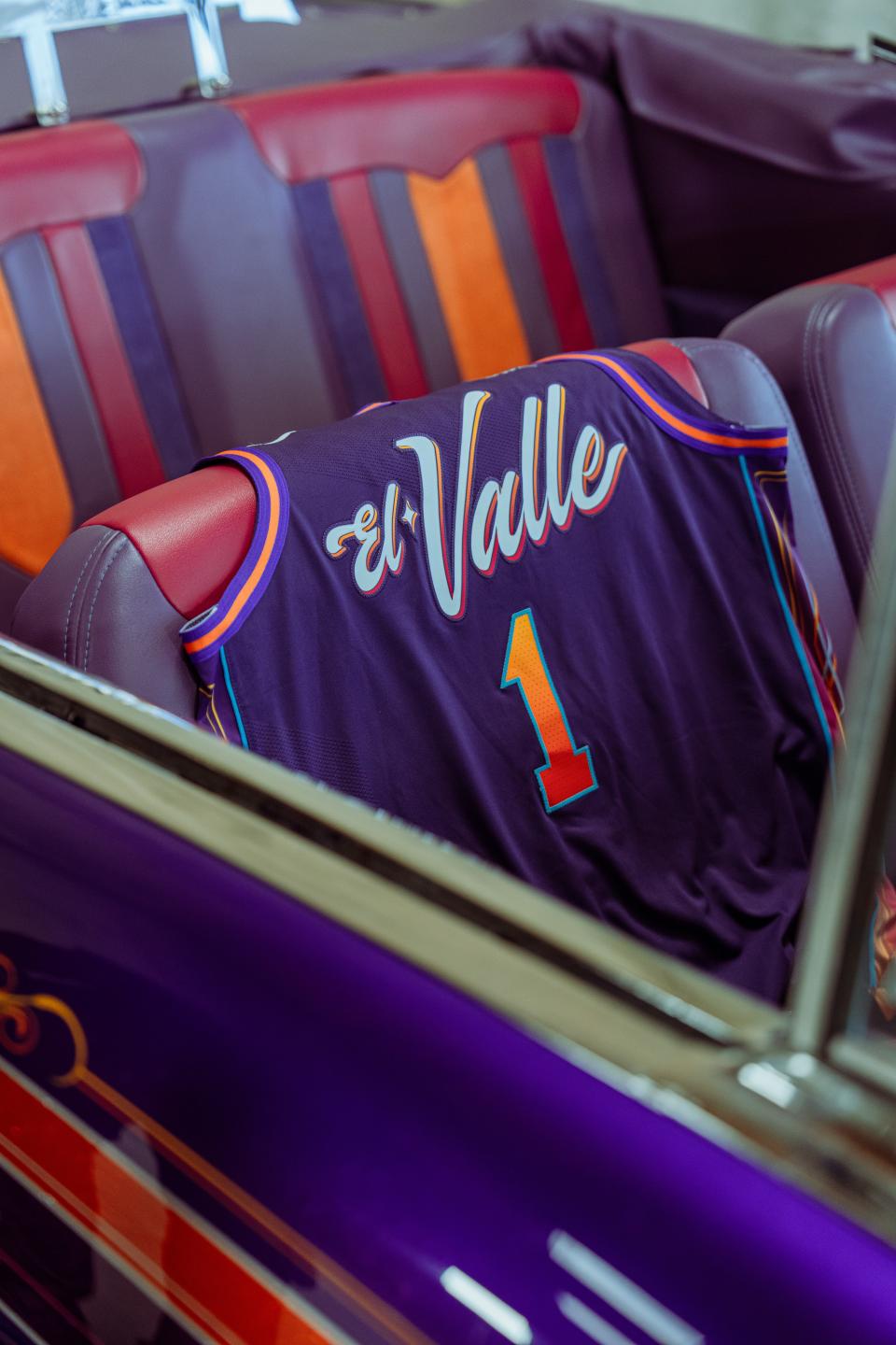 Devin Booker 'El Valle' jersey with car.