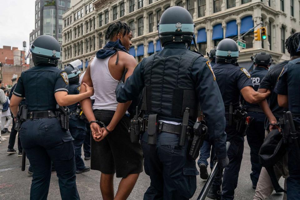 PHOTO: Police officers detain a person after popular live streamer Kai Cenat announced a 'giveaway' event at Union Square in New York City, Aug. 4, 2023. (David Dee Delgado/Reuters)