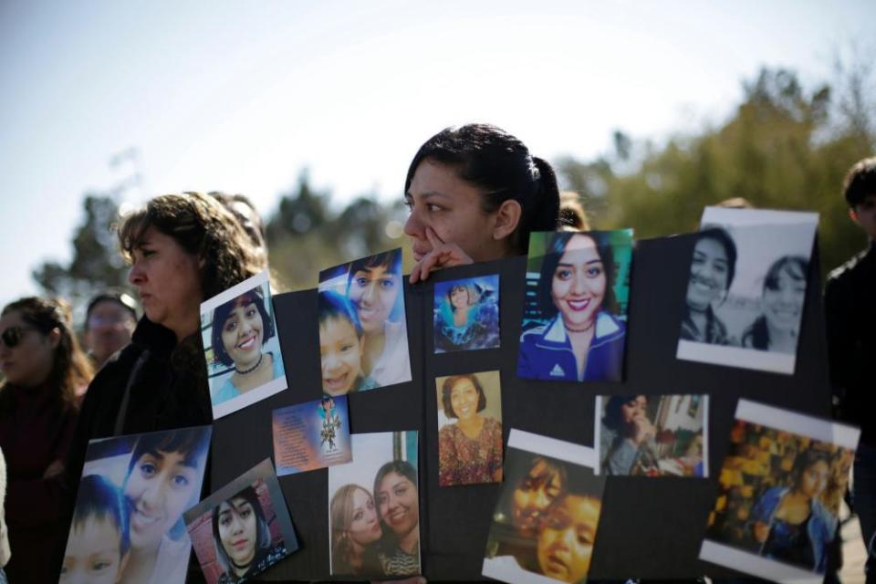 Women react while holding a placard with pictures of Isabel Cabanillas, an activist for women rights whose body was found last Saturday, during a protest to demand justice for her murder, in Ciudad Juarez, Mexico January 19, 2020.