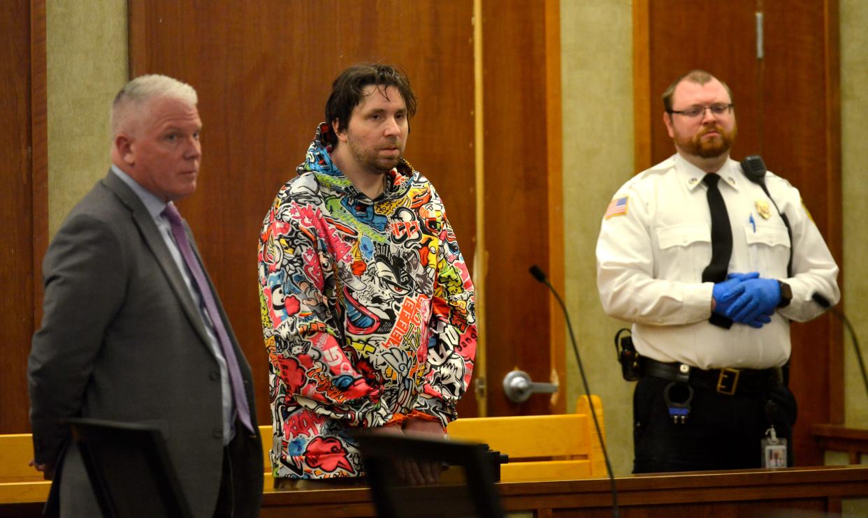 Andreas Miller, center, was in Orleans District Court Wednesday morning with this attorney Matthew Bober, left. Miller was arraigned the day before, Tuesday, for charges related to drug trafficking and possession of explosive materials. He plead not guilty during his arraignment. The arrest was made after two people were found dead at a West Chatham home. One death is from an apparent self-inflicted gunshot wound. The other from an apparent drug overdose.