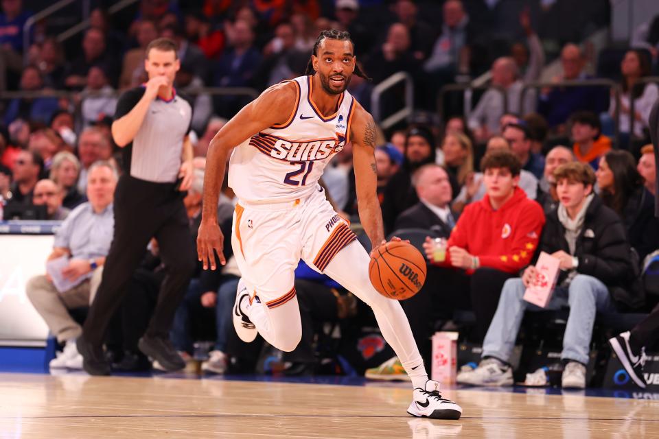 Keita Bates-Diop #21 of the Phoenix Suns drives to the basket during the first half against the New York Knicks at Madison Square Garden on Nov. 26, 2023, in New York City, New York.
