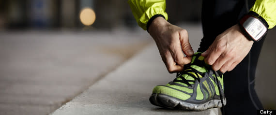 man tying sneaker