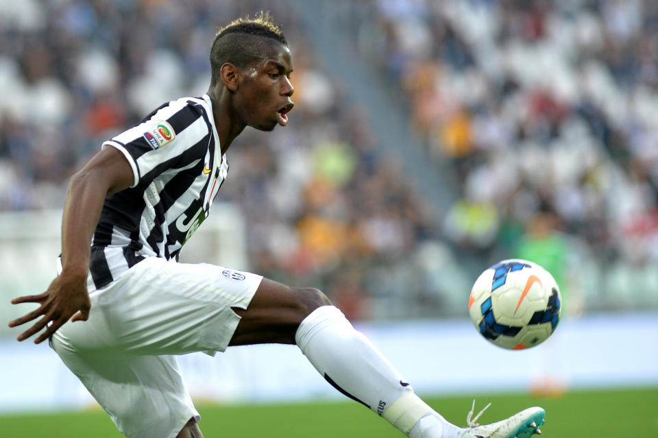 Juventus midfielder Paul Pogba, of France, controls the ball during a Serie A soccer match between Juventus and Livorno at the Juventus stadium, in Turin, Italy, Monday, April 7, 2014. (AP Photo/Massimo Pinca)