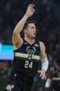 Milwaukee Bucks' Pat Connaughton reacts to his three-point basket during the first half of an NBA basketball game against the Los Angeles Clippers Friday, Dec. 6, 2019, in Milwaukee. (AP Photo/Morry Gash)