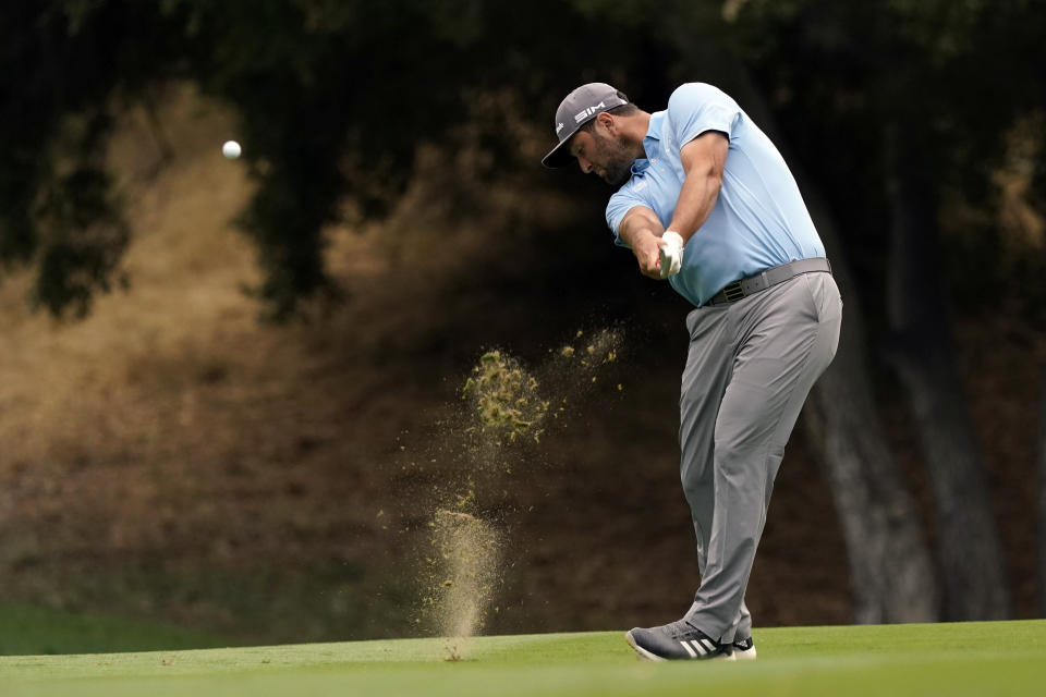 Jon Rahm hits from the 18th fairway during the third round of the Zozo Championship golf tournament Saturday, Oct. 24, 2020, in Thousand Oaks, Calif. (AP Photo/Marcio Jose Sanchez)