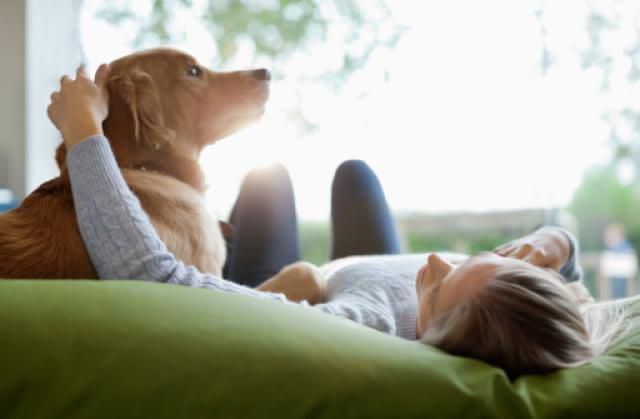 © Getty Images Stock photo of a woman and a dog