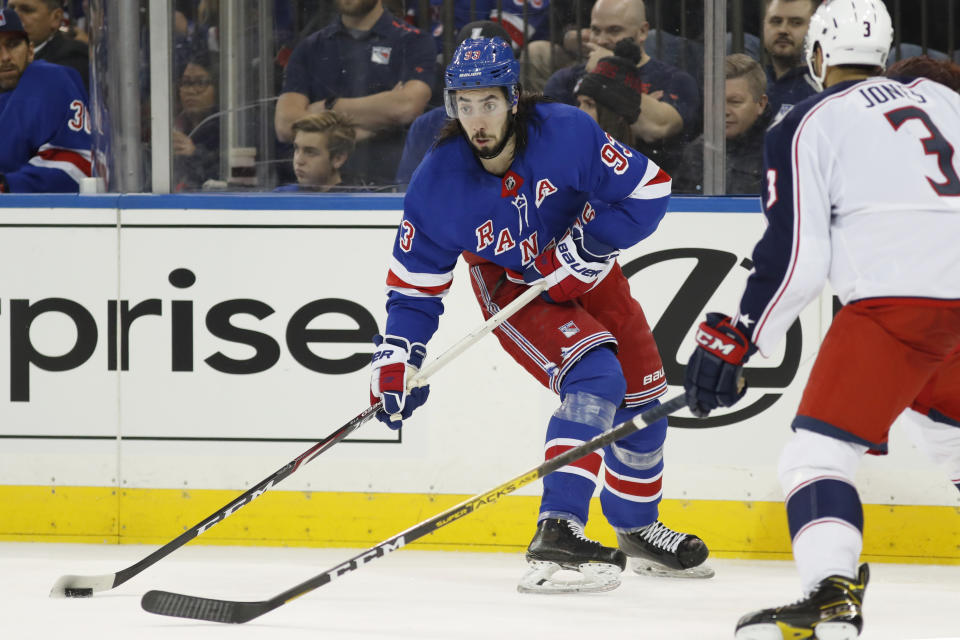 New York Rangers center Mika Zibanejad (93) prepares to pass with Columbus Blue Jackets defenseman Seth Jones (3) looking on during the second period of an NHL hockey game, Sunday, Jan. 19, 2020, in New York. (AP Photo/Kathy Willens)