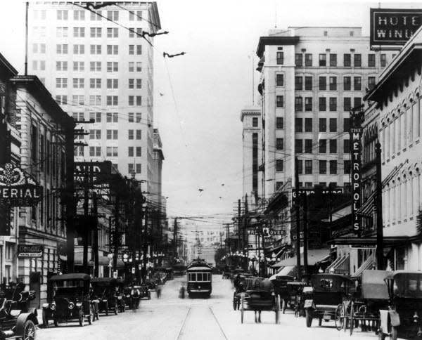 Automobiles and streetcars jockey with horse-drawn carriages on Forsyth Street in this 1914 photo, evidence of the rapidly changing nature of downtown jacksonville.
