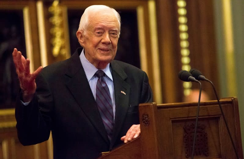 FILE PHOTO: Former U.S. President Jimmy Carter delivers a lecture on the eradication of the Guinea worm, at the House of Lords in London