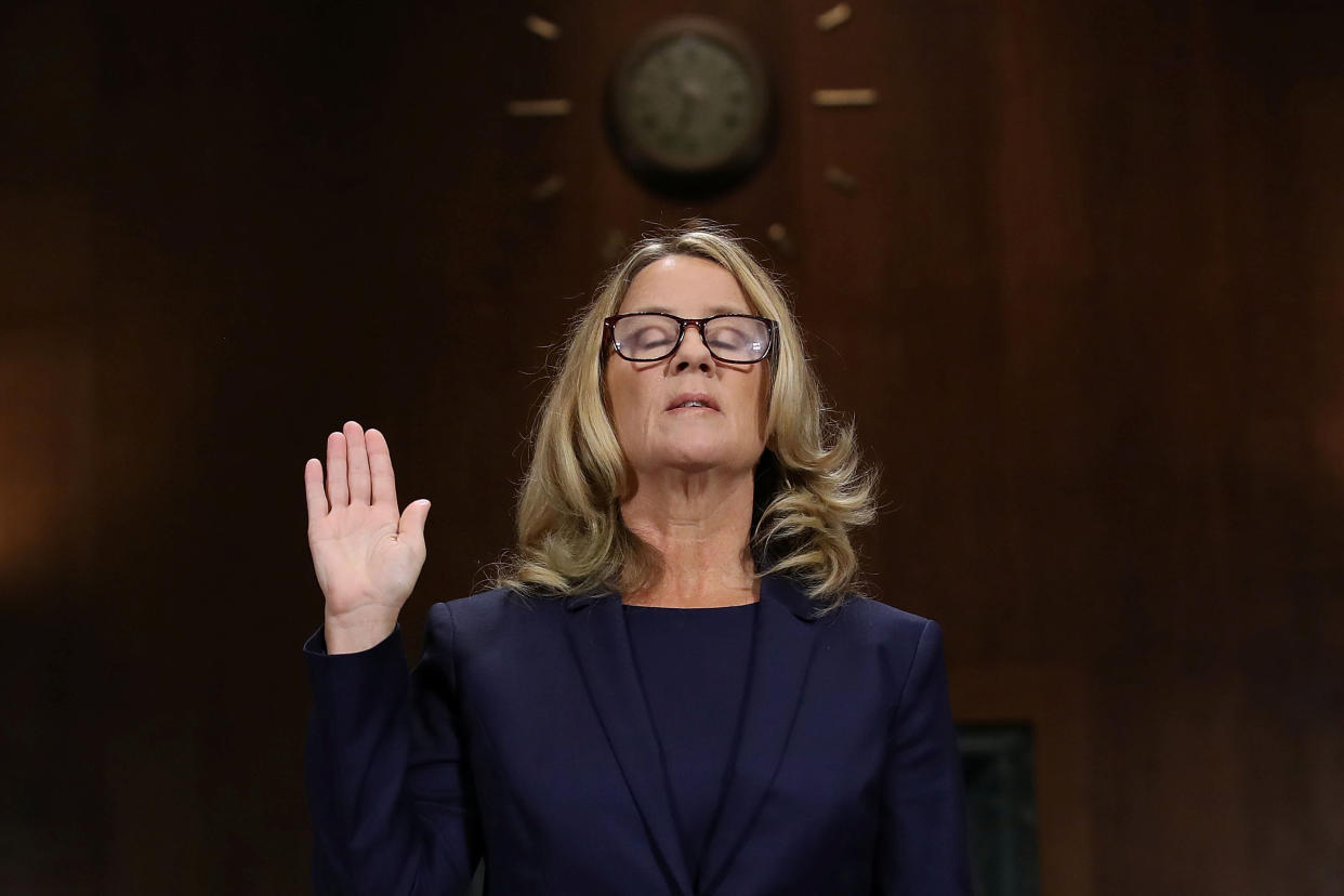 Christine Blasey Ford is sworn in before testifying. (Photo: POOL New / Reuters)