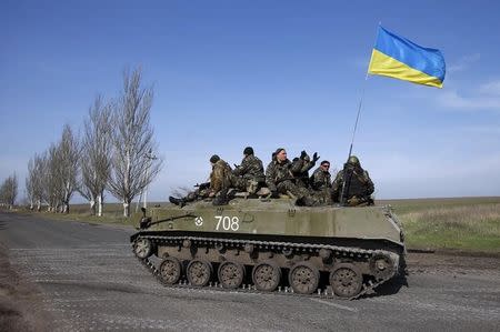 Ukrainian soldiers drive on an airborne combat vehicle near Kramatorsk, in eastern Ukraine April 16, 2014. REUTERS/Marko Djurica