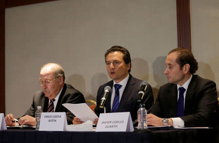 Emilio Lozoya, former chief Executive Officer of Petroleos Mexicanos (Pemex) speaks next to his lawyers Javier Coello Trejo and Javier Coello Zuarth during a news conference at a hotel after he leaves Mexico's attorney general's office, in Mexico City, Mexico August 17, 2017. REUTERS/Henry Romero