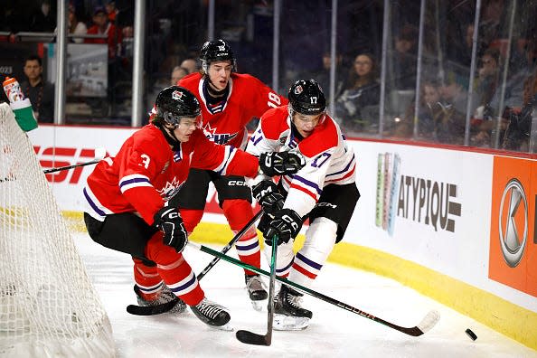 MONCTON, CANADA - JANUARY 24:Sam Dickinson #3 of Team Red stick checks Tij Iginla #17 of Team White during the third period of the 2024 Kubota CHL Top Prospects Game at Avenir Centre on January 24, 2024 in Moncton, Canada. (Photo by Dale Preston/Getty Images)