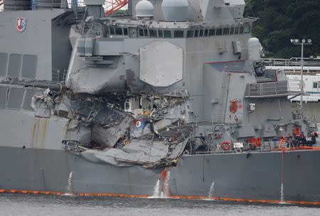 FILE PHOTO : The Arleigh Burke-class guided-missile destroyer USS Fitzgerald, damaged by colliding with a Philippine-flagged merchant vessel, is seen at the U.S. naval base in Yokosuka,, Japan June 18, 2017. REUTERS/Toru Hanai/File Photo