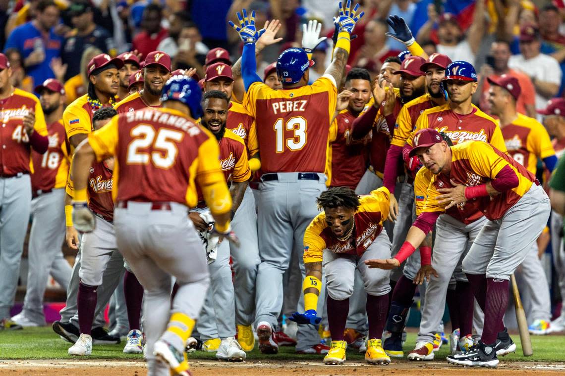 Venezuela base runner Anthony Santander (25) reacts with teammates after hitting a three-run homerun during the first inning of a 2023 World Baseball Classic pool D game against Puerto Rico at loanDepot Park in Miami, Florida, on Sunday, March 12, 2023.