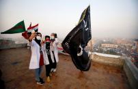 Jassem, 24, an Iraqi nurse takes selfie with her medical colleagues in Baghdad