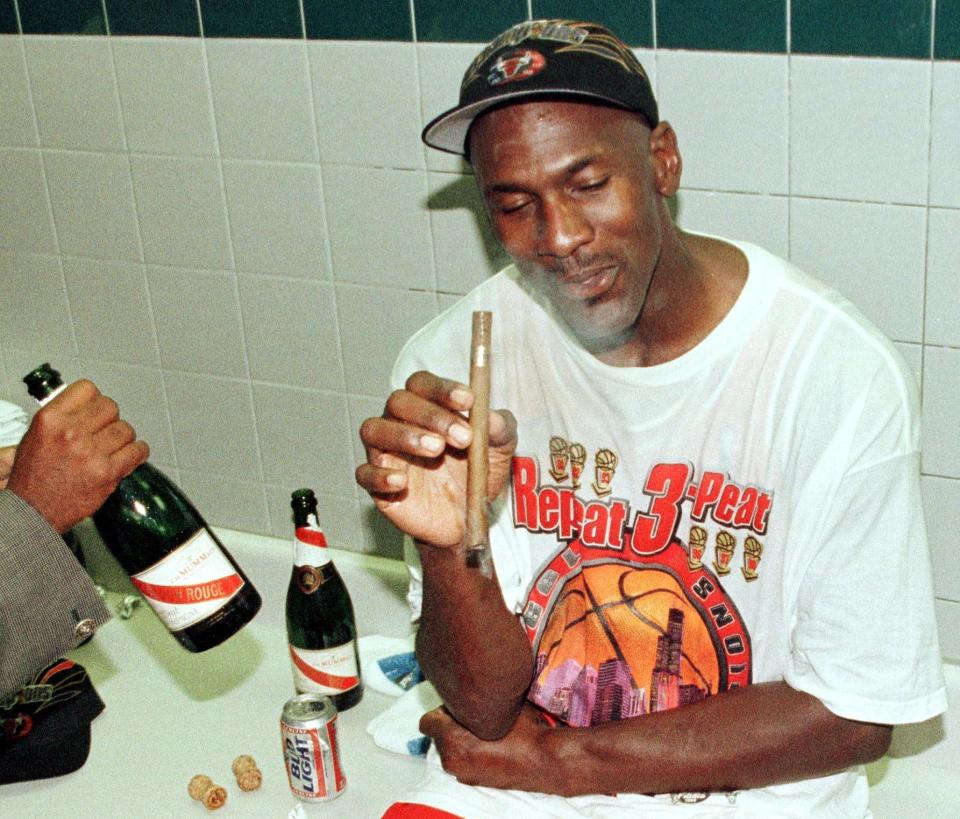 Michael Jordan's love of fine cigars is well-documented. (Photo credit should read MIKE NELSON/AFP via Getty Images)