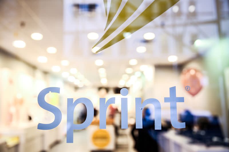 FILE PHOTO: A Sprint sign is seen on top of a Sprint retail store in New York