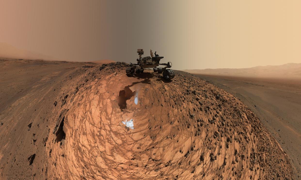 This low-angle self-portrait of NASA's Curiosity Mars rover shows the vehicle above the 'Buckskin' rock target, where the mission collected its seventh drilled sample. The site is in the 'Marias Pass' area of lower Mount Sharp.