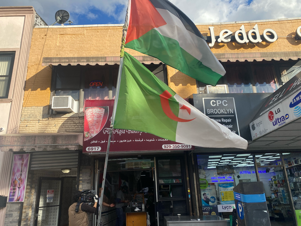 A Palestinian flag flies outside of the Al Aqsa bakery and restaurant in Bay Ridge, Brooklyn (Bevan Hurley)