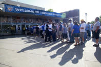 FILE - In this June 12, 2012, file photo, fans line up in front of Chesapeake Arena before Game 1 of the NBA finals basketball series between the Oklahoma City Thunder and the Miami Heat, in Oklahoma City. It used to be that empty seats caused palpitations in team owners and college administrators relying on ticket sales and concessions to beef up the profit margins. Now, those empty seats – and short lines and clear concourses – will be the norm for a while as sports grapples with social distancing requirements. (AP Photo/Jeff Roberson, File)