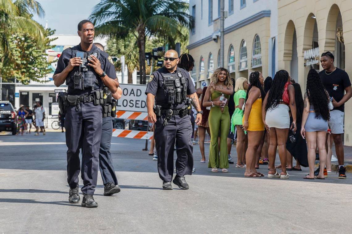 MIami Beach police officer White and officer Cuarezma walk the beat along 10th street between Collins and Ocean Drive during spring break on Miami Beach, Florida on Saturday, March 16, 2024.