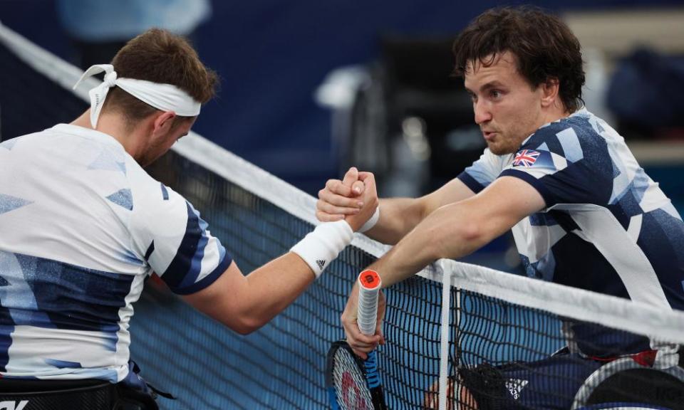 Gordon Reid (right) and Alfie Hewett shake hands at the net after the match.