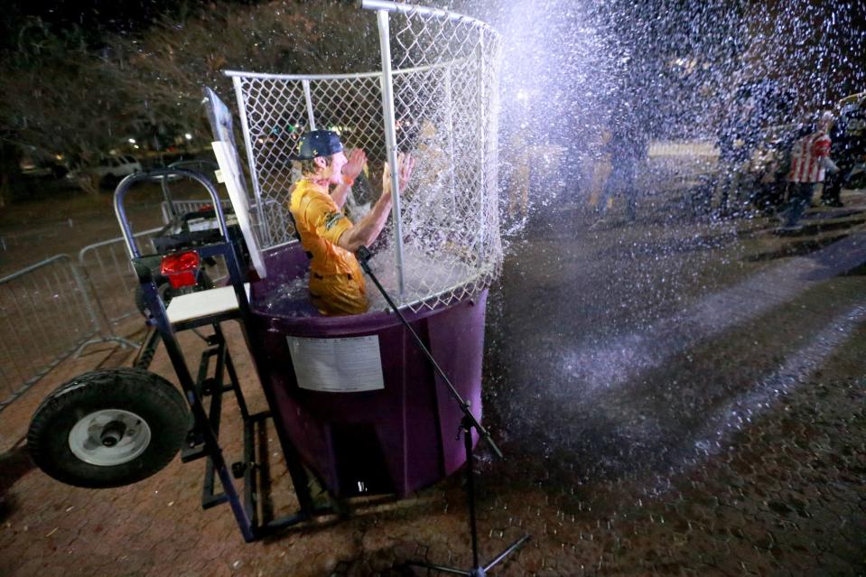 Eric Byrnes splashes water after being dunked Tuesday night outside Grayson Stadium. Byrnes was introduced as the head coach for the Banana Ball team.