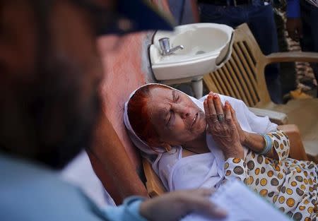 Asgari Begum, mother of Akhalaq Saifi, who was killed by a mob, mourns his death inside her house at Bisara village in Uttar Pradesh, India, October 2, 2015. REUTERS/Anindito Mukherjee