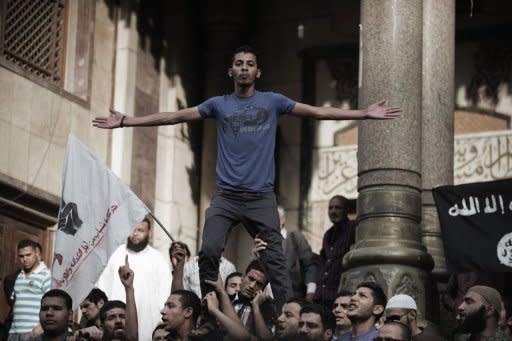 Hundreds of anti-military demonstrators shout slogans outside a mosque in downtown Cairo ahead of a march to the Abbassiya district, May 2. Campaigning for Egypt's first post-uprising presidential poll was temporarily on hold after thugs attacked an anti-military protest near the defence ministry in Cairo, leaving 20 people dead