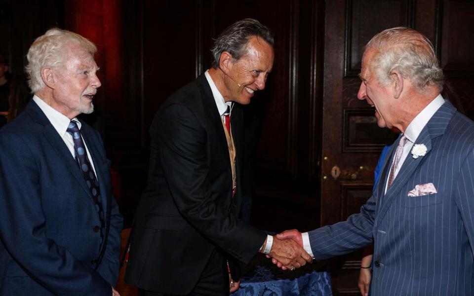 King Charles III meets with actors Derek Jacobi and Richard E. Grant during a reception for the inaugural Queen's Reading Room Literary Festival at Hampton Court Palace on June 11 - ADRIAN DENNIS/AFP