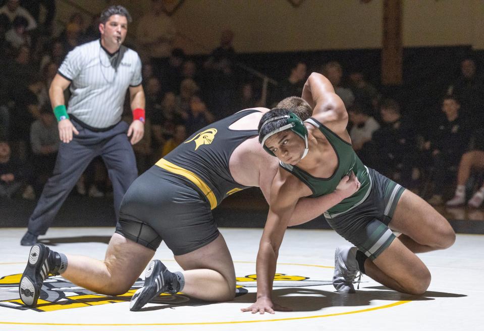 Raritan's Riyan Bhutto (right), shown wrestling St. John Vianney's Ryan Buchanan on Jan. 11, recorded a key pin in sudden victory in the heavyweight bout in Raritan's 34-33 win over Delaware Valley Thursday night on criteria - most bouts won, 8-6.
