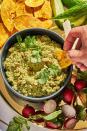 <p>If salsa verde and hummus had a child, it would remind us of this dip. Our version of <em>sikil p’ak</em>, which in Mayan means “pumpkin seed” and “tomato” respectively, is inspired by the Yucatecan version. Our riff uses hulled pepitas and charred tomatillos, and its subtle smokiness will keep you coming back for more.</p><p>Get the <strong><a href="https://www.delish.com/cooking/recipe-ideas/a37048883/sikil-pak-pumpkin-seed-dip/" rel="nofollow noopener" target="_blank" data-ylk="slk:Sikil P’ak Pumpkin Seed Salsa recipe;elm:context_link;itc:0;sec:content-canvas" class="link ">Sikil P’ak Pumpkin Seed Salsa recipe</a></strong>.</p>