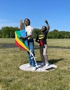 Two boys trying to capture the right wind for their kite is the subject of "Out of Sight," a sculpture by Seward Johnson now on display at Memorial Park in Lower Makefield.