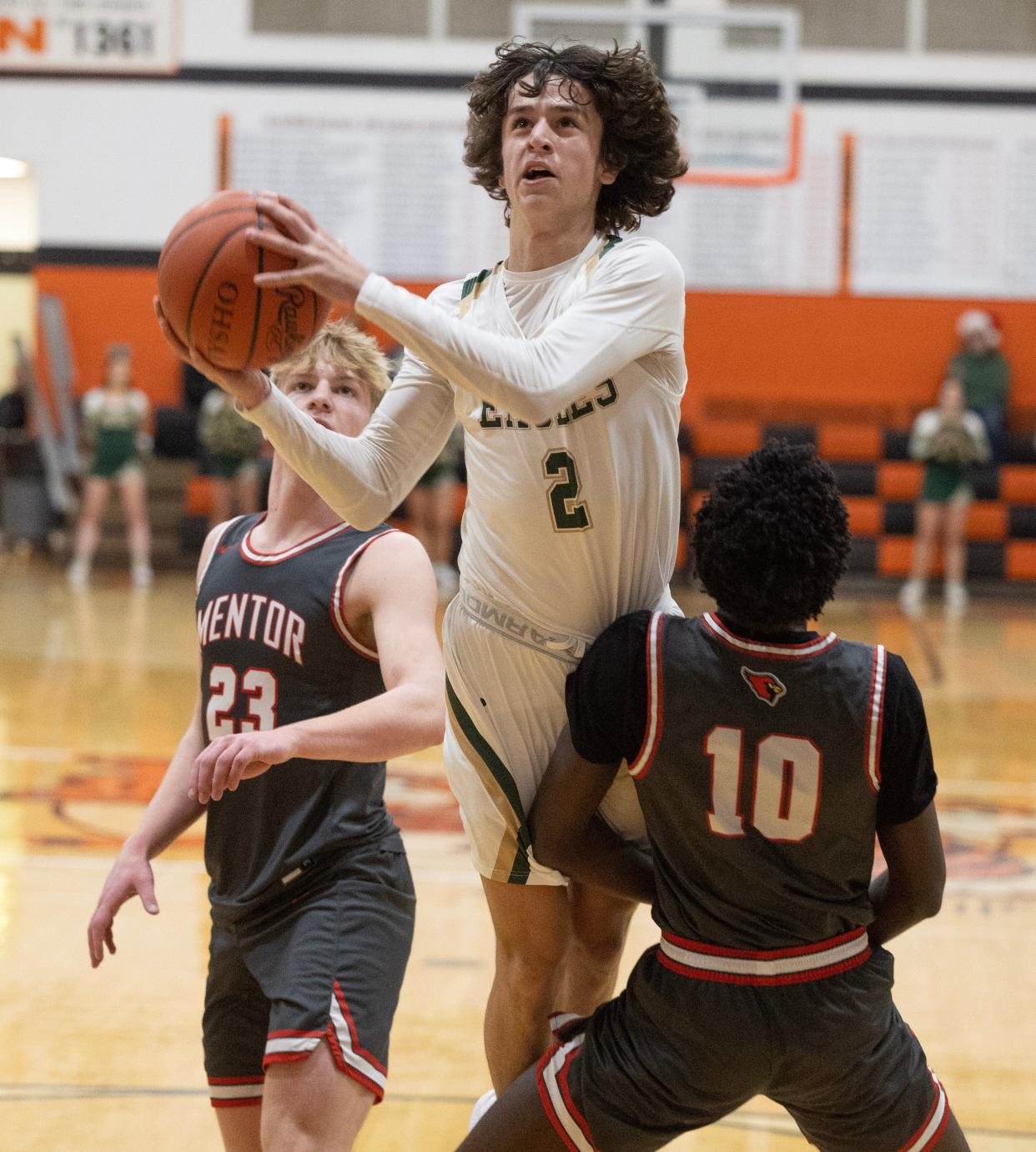 GlenOak guard Bryce Broom drives to the hoop against Mentor.