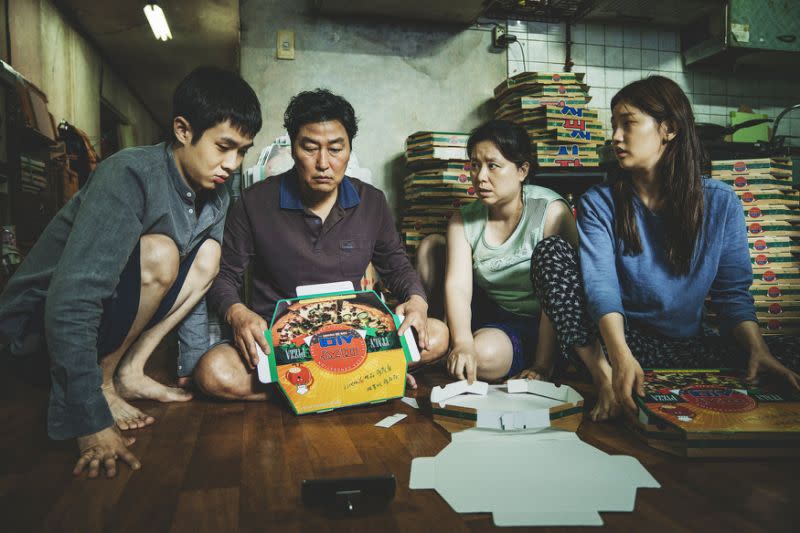 Park So Dam, far right, in Parasite. (Photo: Curzon)