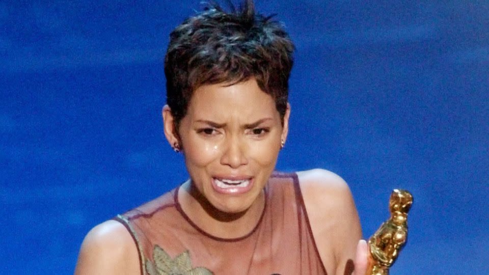 Halle Berry accepts her Oscar for best actress for her role in "Monsters Ball" during the 74th annual Academy Awards in 2002. - Kevork Djansezian/AP