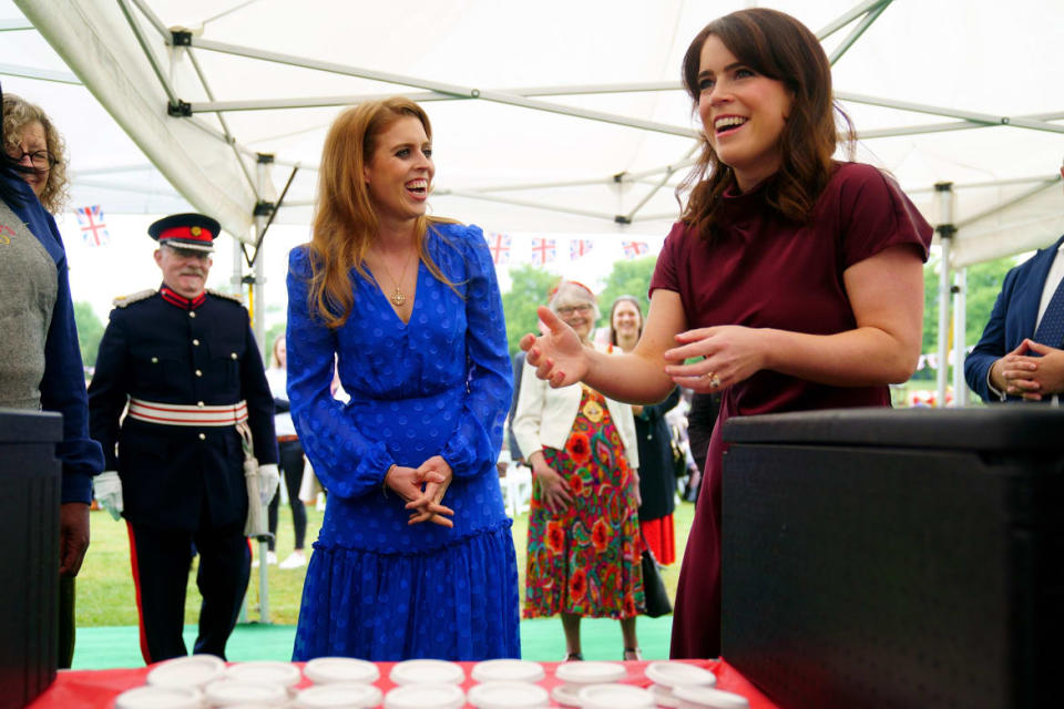 <div class="inline-image__caption"><p>Princess Beatrice and Princess Eugenie talk with members of the public during the Big Jubilee Lunch on day four of the Platinum Jubilee celebrations.</p></div> <div class="inline-image__credit">Victoria Jones/PA Images via Getty</div>